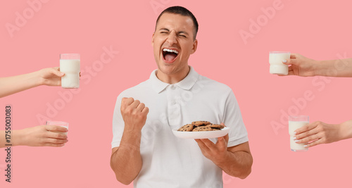 Happy young man with cookie...