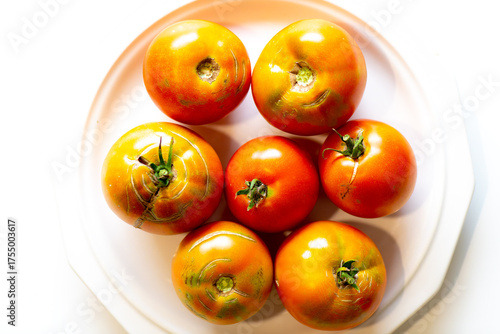 Tomatos arranged on a white plate