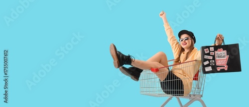Happy young woman with shop...