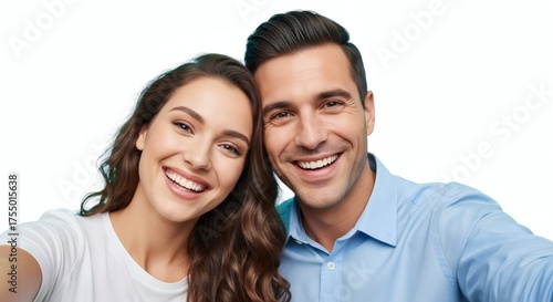 Happy couple taking a selfie, smiling and looking at the camera together