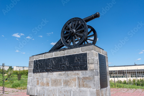 Kamenskaya cannon or gun monument or memorial on pedestal with bas-reliefs in city Kamensk-Uralsky, Sverdlovsk region, Ural, Russia