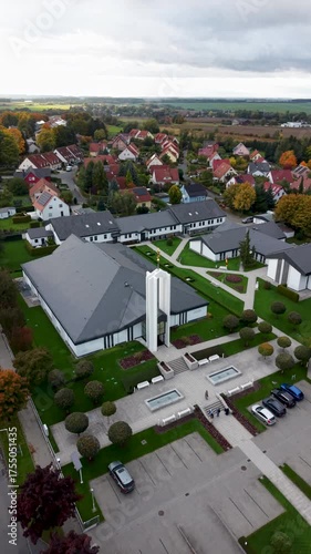 Aerial Freiberg Germany LDS Temple circle vertical pull. The Church of Jesus Christ of Latter-day Saints, LDS or Mormon religion. Urban and rural neighborhood. Christian religious groups. European.