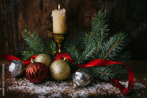 Vintage metallic Christmas decorations with ribbon and candlelight