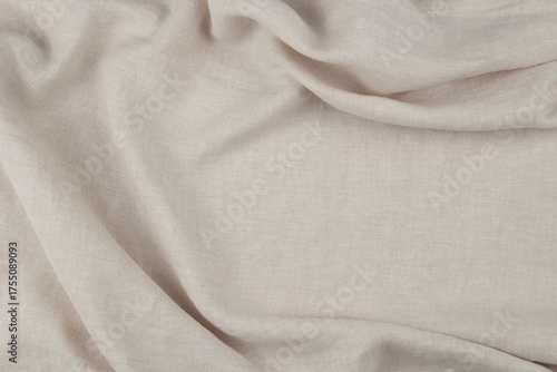 Beige linen fabric with soft folds, natural eco textile texture for minimalist background