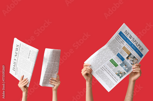 Female hands with newspaper...