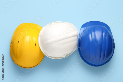 Colorful hardhats on blue b...