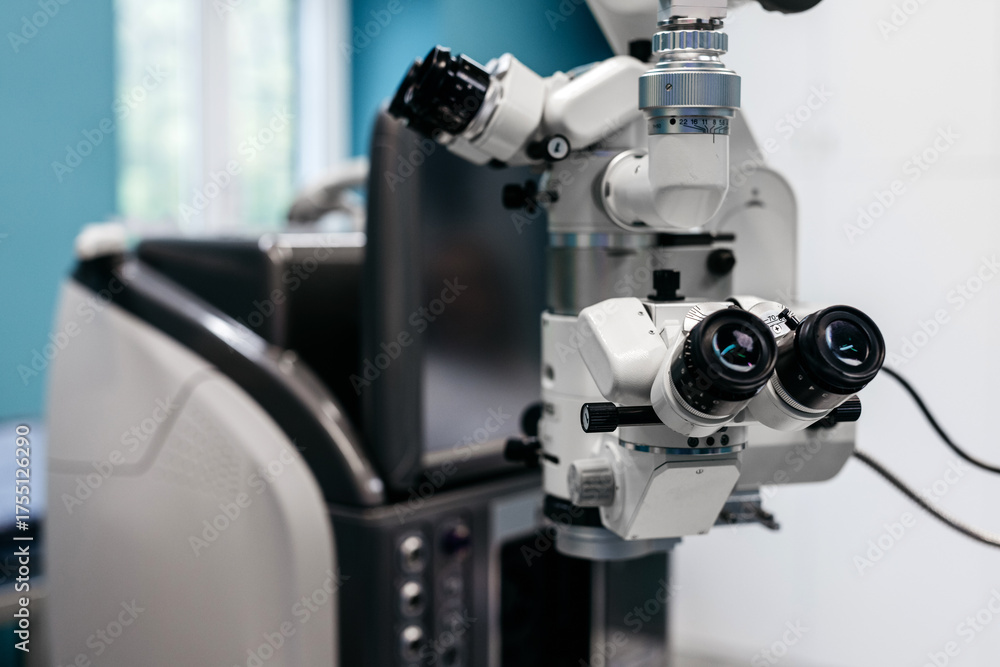 Fototapeta premium Advanced ophthalmology equipment featuring a high-precision laser vision correction device, showcasing intricate details and modern technology in a clinical examination setting