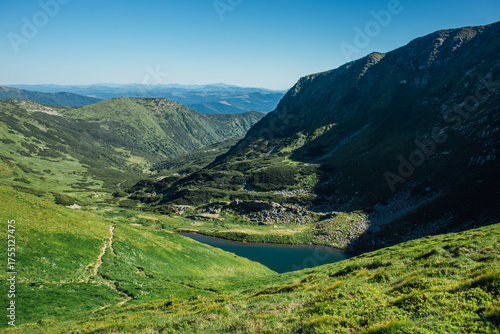 Landscape with mountain lake Brebeneskul. Green carpathian nature