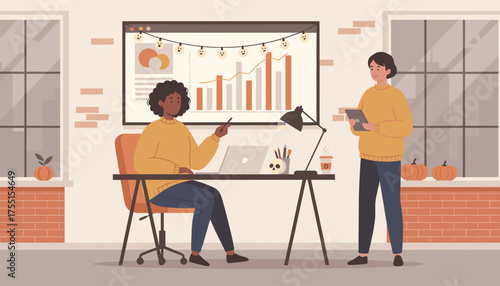 Business colleagues collaborate on data analysis in a modern autumndecorated office