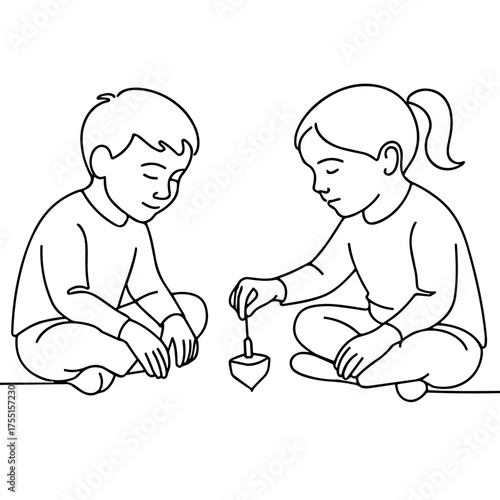 Two children playing with a dreidel on the floor in winter  