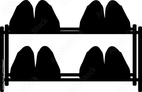 Two pairs of black shoes on a two tier shoe rack with a clean white background silhouette isolated on white background
