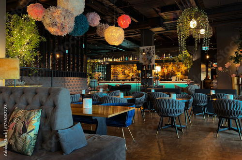 An interior photograph showcasing the chic, modern, and luxurious design of a restaurant, lounge, or high-end cafe. 