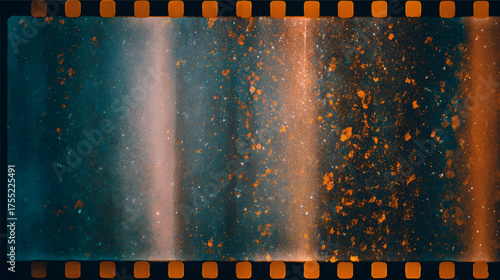 A textured film strip with a blend of blue and orange hues, featuring specks and scratches that create a vintage aesthetic