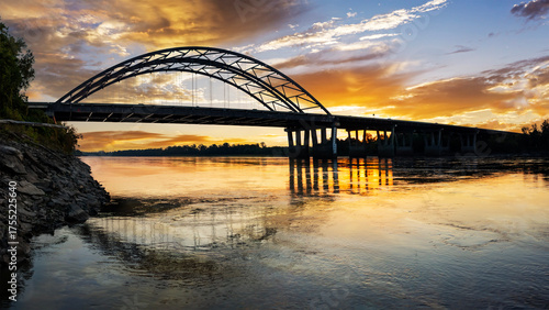 Dramatic sunrise panoramic view of the Veterans Memorial Bridge over the Missouri River at St. Charles, MO
