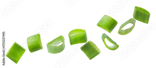 Tableau sur toile Fresh cut green onion flying on white background