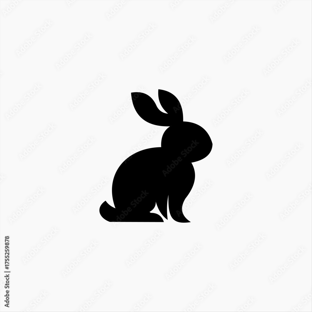 Fototapeta premium Clean and simple black silhouette of a sitting rabbit. This minimalist bunny graphic works as an icon, logo, or symbol for Easter, wildlife, and pet-related concepts
