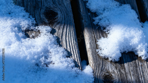 Winter wooden surface with gentle snowfall, cold seasonal atmosphere. travel magazines, destination branding, designed for outdoor magazines and nature guides, inspires travel planning.

