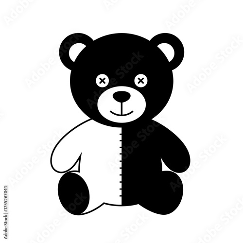 Cute black and white teddy bear toy with stitched seams and button eyes sitting playfully