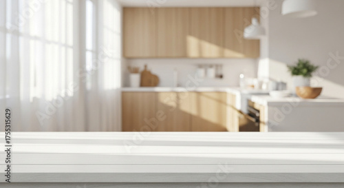 White wooden tabletop foreground with a bright modern kitchen backdrop.