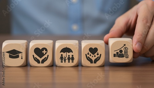 Conceptual wooden blocks depicting life priorities education health family and wealth
