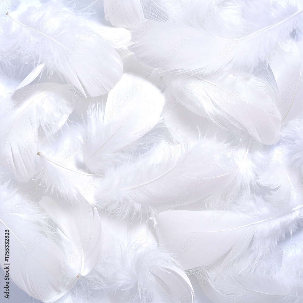 Fototapeta premium Delicate white feathers gracefully scattered across a vibrant blue background, creating a serene and calming visual contrast that evokes tranquility.