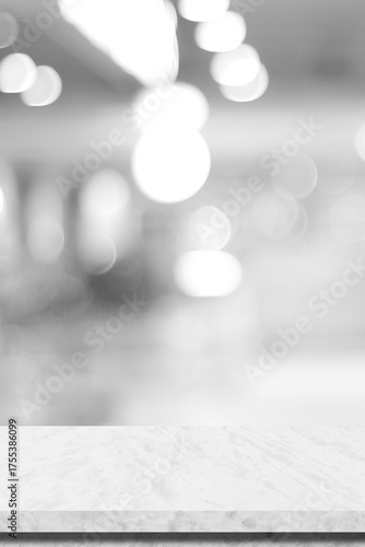 Empty vertical white table top, counter, desk background over blur  bokeh background, White marble stone table, shelf and blurred kitchen restaurant for food, product display mockup, template