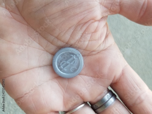 A Plastic Coin, Money that Looks Like a Dime in the Palm of My Hand