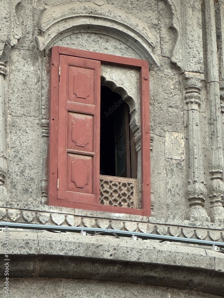 Fototapeta premium Rajwada Palace Indore—historic royal landmark, ornate Maratha architecture, carved wooden balconies and arched windows, iconic heritage building in Madhya Pradesh, India.