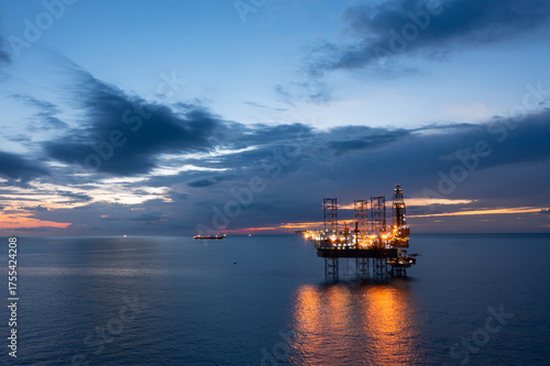 Wallpaper Mural Aerial view of offshore jack up rig and offshore platform during sunset for oil and gas exploration and production. Torontodigital.ca