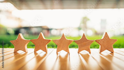 Five wooden stars lined up symbolizing excellent customer satisfaction, high-quality rating, or premium service. Ideal for business reviews, testimonials, and service quality concepts.