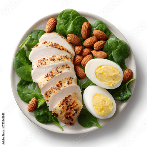 Sliced grilled chicken breast with almonds and hardboiled egg