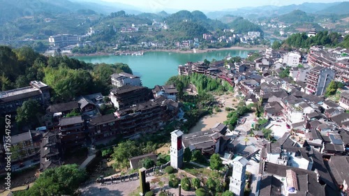 The ancient houses of Furong Town hanging on the cliff waterfall