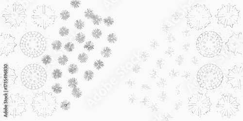 Abstract snowflake patterns in shades of gray on a white background