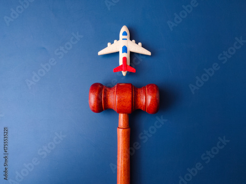The image, which features a toy airplane next to a judge's gavel, is a visual representation of aviation law