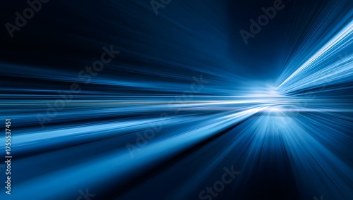 Abstract blue light streaks and lines creating a sense of rapid motion and futuristic digital technology on a dark background