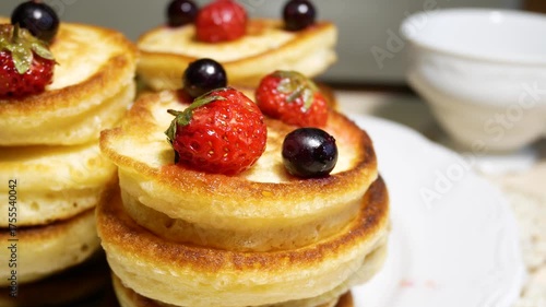 Wallpaper Mural Appetizing pancakes on a plate. Pancakes are decorated with fresh strawberries and currants on top. Delicious breakfast. Torontodigital.ca