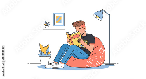 Young man enjoying a book while relaxing on a bean bag in a cozy setting