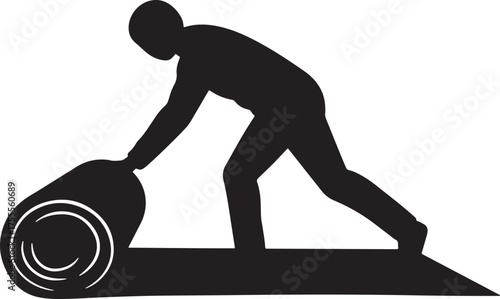 Man unrolling a carpet in silhouette