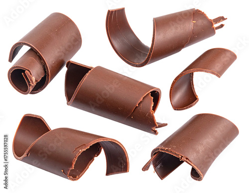 Scattered chocolate curls isolated on white background. Close-up of cocoa shavings for cake or ice cream decoration.