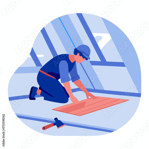 Builder installing laminate flooring in attic workspace  