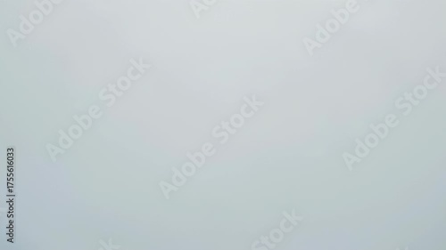 An abstract image of concentric ripples in a pale liquid surface