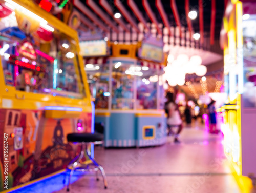 Blurred Defocused Arcade Game Center with Colorful Neon Lights and People Walking in Entertainment Venue