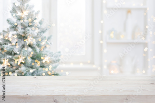 Wooden table empty space in front of decorated for Christmas and New Year blurred domestic room interior