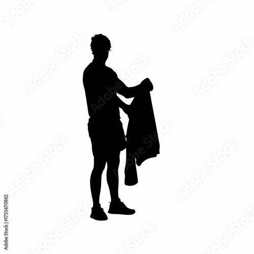 Silhouette of a rehab worker folding towels after therapy isolated on white background