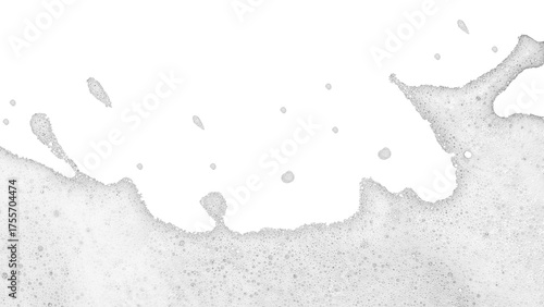 High-key abstract photograph of layer of white foam or suds spreading across bottom portion of pure white background. Foam composed numerous tiny delicate bubbles textured slightly frothy appearance