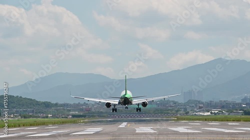 4K Back view on landing airplane