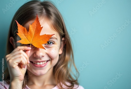 Autumn mood, happy smiling girl closes her eye with fall maple leaf, on blue background, promo poster template for seasonal autumn marketing, sale