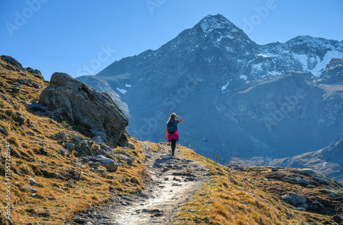 Young woman with backpack h...