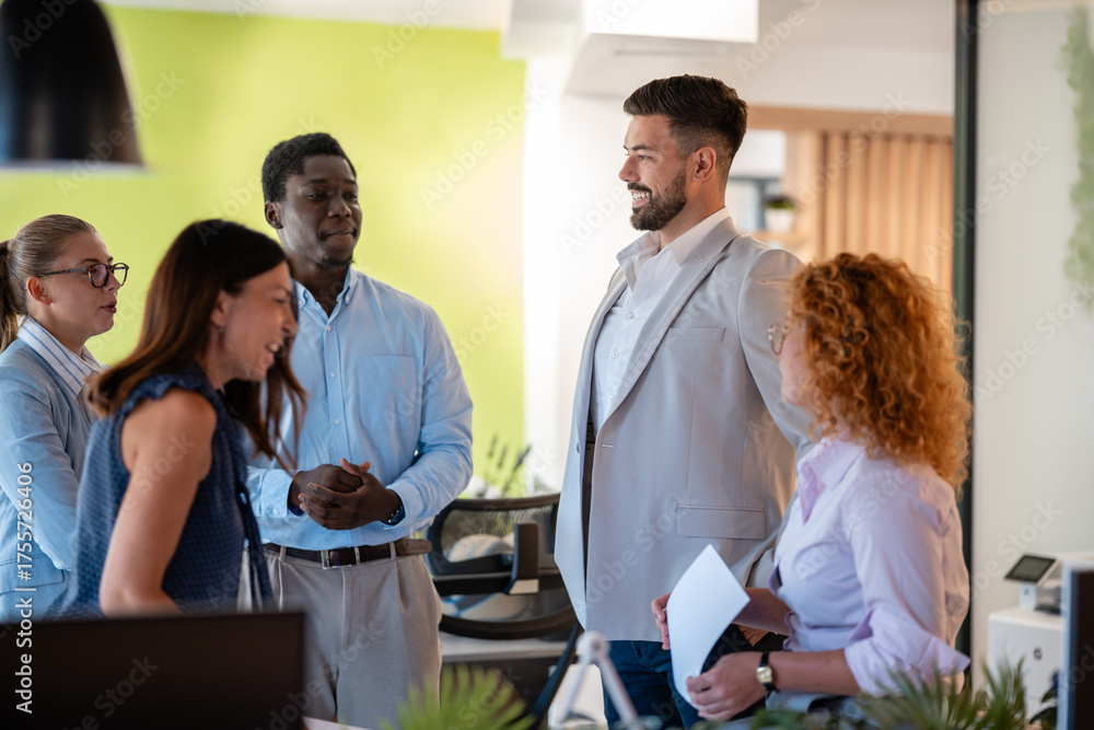 Fototapeta premium Diverse business team having casual discussion in modern office