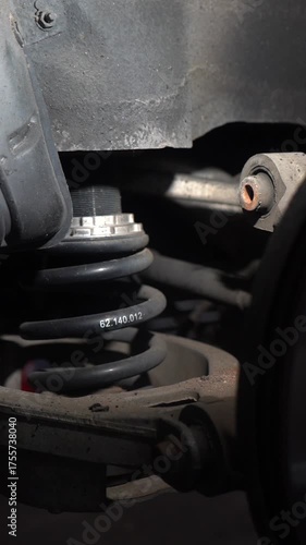 Car suspension spring. A component of a passenger car's suspension.